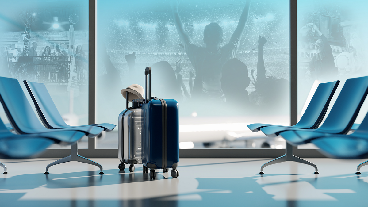 Luggage waiting in an airport departure lounge before a football travel trip